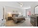 Cozy bedroom featuring wood floors, a ceiling fan, and a sliding glass door to balcony at 167 Villa Di Este Ter Ter # 213, Lake Mary, FL 32746