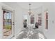 Bright dining nook with water views and gray modern chairs at 167 Villa Di Este Ter Ter # 213, Lake Mary, FL 32746