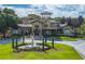 Beautiful community center showcases manicured grounds, a fountain, and well-maintained landscaping at 167 Villa Di Este Ter Ter # 213, Lake Mary, FL 32746