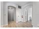 Bright hallway with doors and arched entryways, and light wood flooring at 167 Villa Di Este Ter Ter # 213, Lake Mary, FL 32746