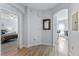 Bright hallway leads to a cozy bedroom and dining area with light wood floors at 167 Villa Di Este Ter Ter # 213, Lake Mary, FL 32746