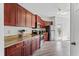 Spacious kitchen with wood cabinets, stainless appliances, and granite countertops at 167 Villa Di Este Ter Ter # 213, Lake Mary, FL 32746