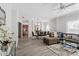 Spacious living room with open layout, light wood floors, and modern decor at 167 Villa Di Este Ter Ter # 213, Lake Mary, FL 32746