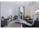 Sitting area with neutral walls, gray furniture, and a decorative globe at 167 Villa Di Este Ter Ter # 213, Lake Mary, FL 32746