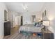 Bright and airy main bedroom boasts modern decor, wood-look flooring, and ample closet space at 167 Villa Di Este Ter Ter # 213, Lake Mary, FL 32746