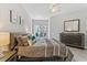 Cozy main bedroom features a sliding glass door to a private balcony and stylish furnishings at 167 Villa Di Este Ter Ter # 213, Lake Mary, FL 32746