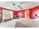 Bedroom with an arched doorway, a ceiling fan, carpet flooring, and a window with natural light at 1709 Palm Beach Dr, Apopka, FL 32712