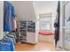 Walk-in closet features ample storage space with built-in shelving and a cozy window seat at 1709 Palm Beach Dr, Apopka, FL 32712