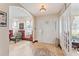 Welcoming foyer with decorative tile, a white front door with sidelights, and an arched doorway at 1709 Palm Beach Dr, Apopka, FL 32712