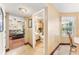 Inviting hallway view showcasing the bathroom, living room with hardwood floors, and neutral wall colors at 1709 Palm Beach Dr, Apopka, FL 32712