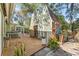 Exterior view of a shed with a white door on a wood deck, surrounded by lush vegetation at 1709 Palm Beach Dr, Apopka, FL 32712