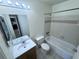 Bathroom featuring a vanity, toilet, mirror and bathtub with shower at 1932 Lake Atriums Cir # 85, Orlando, FL 32839