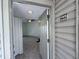 View from the doorway into a condo with neutral paint, tile flooring, and a ceiling fan at 1932 Lake Atriums Cir # 85, Orlando, FL 32839