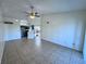 Living space with tile floors, open to the kitchen, featuring neutral paint and bright natural light at 1932 Lake Atriums Cir # 85, Orlando, FL 32839