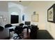 Dedicated home office space with large windows and a modern desk setup for focused work at 1932 Lake Atriums Cir # 85, Orlando, FL 32839