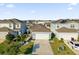 Aerial view of the house with manicured lawn, shrubs and shade trees at 2234 Bluebird Pl, St Cloud, FL 34771