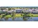 Aerial view of a home and community, backing onto a serene pond, offers both privacy and natural beauty at 2263 Mallard Creek Cir, Kissimmee, FL 34743