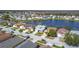Scenic aerial view of a residential neighborhood along the lake at 2263 Mallard Creek Cir, Kissimmee, FL 34743