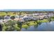 An aerial shot of the home, backing up to a pond, highlighting the neighborhood's peaceful and scenic location at 2263 Mallard Creek Cir, Kissimmee, FL 34743