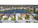 Scenic aerial view of a residential neighborhood and the lake at 2263 Mallard Creek Cir, Kissimmee, FL 34743