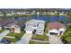 Beautiful aerial view of a gray two-story home with scenic lake view at 2263 Mallard Creek Cir, Kissimmee, FL 34743