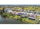 An aerial view showcases a lakeside neighborhood, offering stunning views and tranquil living by the water at 2263 Mallard Creek Cir, Kissimmee, FL 34743