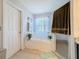 Bathroom with a walk in shower and a big soaking tub at 2263 Mallard Creek Cir, Kissimmee, FL 34743