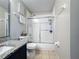 Bathroom with shower over tub and granite vanity at 2263 Mallard Creek Cir, Kissimmee, FL 34743