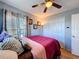 This is a cozy bedroom with a large closet and hardwood floors at 2263 Mallard Creek Cir, Kissimmee, FL 34743