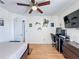 This home has a spacious bedroom, hardwood floors, and a ceiling fan at 2263 Mallard Creek Cir, Kissimmee, FL 34743