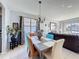 Dining room featuring decorative chandelier lighting and seating for six people at 2263 Mallard Creek Cir, Kissimmee, FL 34743