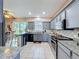 Bright kitchen features stainless steel appliances, granite countertops, and ample cabinet space at 2263 Mallard Creek Cir, Kissimmee, FL 34743
