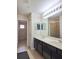 Bathroom featuring double sink vanity, tile flooring, and walk-in shower at 2355 Seven Oaks Dr, St Cloud, FL 34772