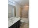Bathroom featuring vanity sink, shower and tub combination at 2355 Seven Oaks Dr, St Cloud, FL 34772