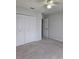 Bedroom featuring neutral carpet, a ceiling fan, and closet at 2355 Seven Oaks Dr, St Cloud, FL 34772