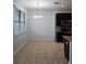 Eat-in kitchen area features a stylish chandelier and modern cabinetry, creating a cozy dining space at 2355 Seven Oaks Dr, St Cloud, FL 34772