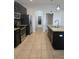 Functional kitchen showcases stainless steel appliances, granite countertops, and ample storage, enhancing culinary experience at 2355 Seven Oaks Dr, St Cloud, FL 34772