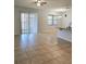 Bright living room with large sliding glass doors and tile flooring, perfect for indoor-outdoor living at 2355 Seven Oaks Dr, St Cloud, FL 34772