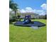 Community playground with a colorful slide, soft landing and surrounding green space at 2355 Seven Oaks Dr, St Cloud, FL 34772
