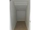 Small storage area with tiled floor and angled ceiling at 2355 Seven Oaks Dr, St Cloud, FL 34772