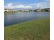 Peaceful community pond view with a fountain and well-maintained landscaping at 2355 Seven Oaks Dr, St Cloud, FL 34772