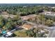 Aerial view of a home nestled among lush greenery, showcasing the generous lot and peaceful surroundings at 23940 Oak Ln, Sorrento, FL 32776