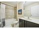 This full bathroom features a shower-tub combo and a large vanity at 2551 Dharma Cir, Kissimmee, FL 34746