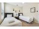 This cheerful bedroom features two twin beds, cartoon decor, and a ceiling fan at 2551 Dharma Cir, Kissimmee, FL 34746
