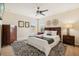 This charming bedroom features a large bed, dresser, and stylish decor at 2551 Dharma Cir, Kissimmee, FL 34746