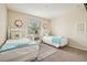 Cozy bedroom features two twin beds, a window, and a nightstand at 2551 Dharma Cir, Kissimmee, FL 34746