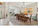 Spacious dining area with seating for six, open to the living room and with ample natural light at 2551 Dharma Cir, Kissimmee, FL 34746