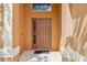 Close up image of front door with sidelight window and modern hardware, set within columned porch at 2551 Dharma Cir, Kissimmee, FL 34746