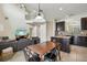 Eat in kitchen open to the Gathering room and has an island, tile backsplash, and pendant lighting at 2551 Dharma Cir, Kissimmee, FL 34746