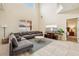 Open-concept living room with tile floors, high ceilings, and plenty of natural light at 2551 Dharma Cir, Kissimmee, FL 34746